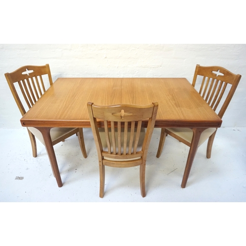 561 - TEAK EXTENDING DINING TABLE
the pull apart top revealing a fold out leaf, standing on turned taperin... 