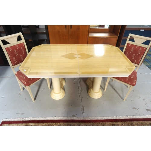 565 - WOOD EFFECT DINING TABLE
with canted corners and a printed design to the pull apart top, with an ext... 