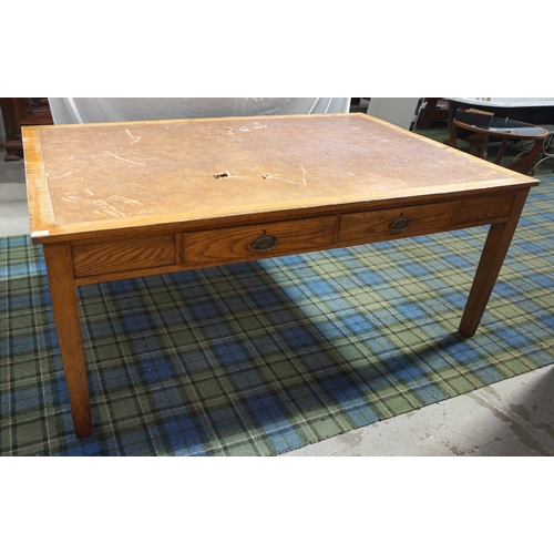 540 - 1930s LIGHT OAK DESK
with an inset leather effect top above two frieze drawers, standing on tapering... 