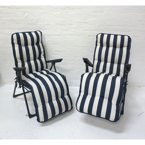 526 - PAIR OF FOLDING DECK CHAIRS
the grey metal frames with plastic arm rests and blue & white striped cu... 