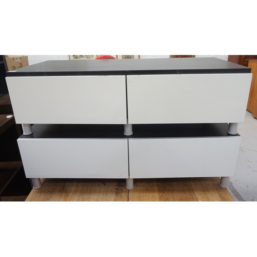 523 - TWO LOW STAINED WOOD SIDE CABINETS
both with two frieze drawers, standing on turned aluminium suppor... 