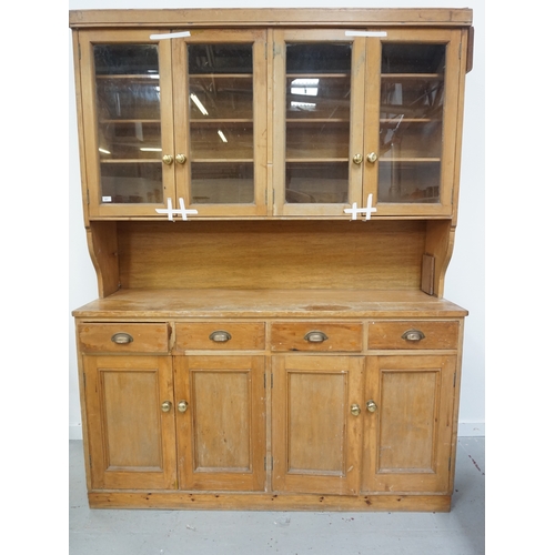 537 - VICTORIAN AND LATER PINE KITCHEN DRESSER
with a plain top above two pairs of glass doors opening to ... 