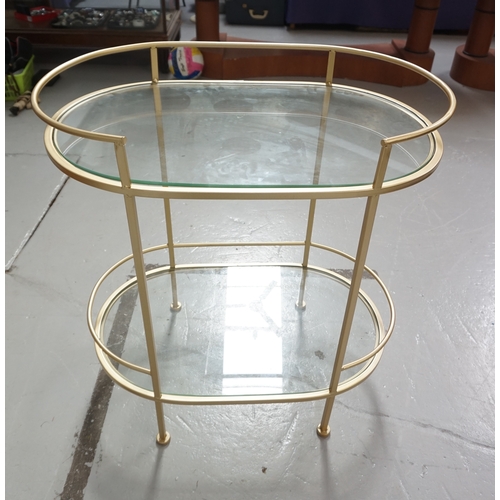 531 - TIERED GLASS OCCASIONAL TABLE
with bronze coloured oval metal frame, with two plate glass tiers