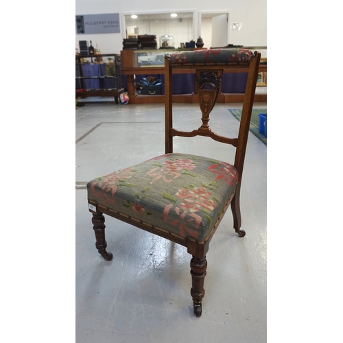 511 - EDWARDIAN INLAID WALNUT NURSING CHAIR
with carved and shaped detail to backrest, fabric covered padd... 