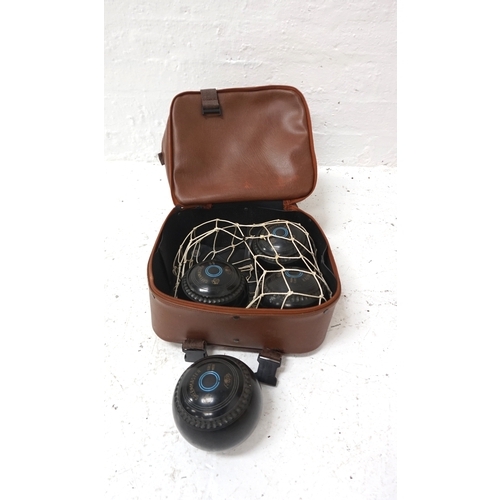 321 - SET OF GREENMASTER LAWN BOWLS
size 3 and contained in a bowls bag