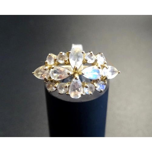 70 - MOONSTONE CLUSTER RING
the pear and round cut moonstones in pierced setting, on nine carat gold shan... 