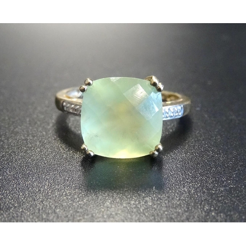 85 - UNUSUAL APATITE AND DIAMOND DRESS RING
the central cushion briolette cut apatite flanked by diamond ... 