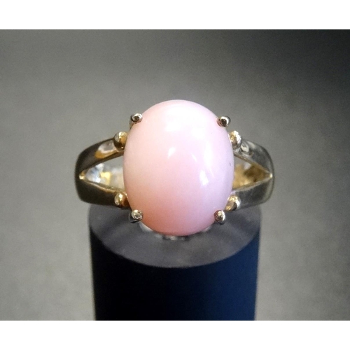 90 - PERUVIAN PINK OPAL DRESS RING
the oval cabochon opal on nine carat gold shank with decorative split ... 