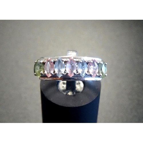 115 - MULTI GEM SET SEVEN STONE RING
with alternating marquise cut peridots, pink topaz and aquamarines, o... 