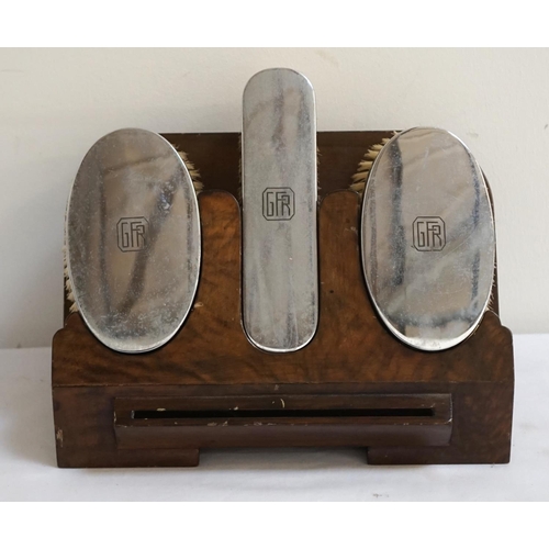 188 - THREE SILVER BACKED BRUSH SET 
comprising two oval and one oblong brush, all with 'GFR' monogram to ... 