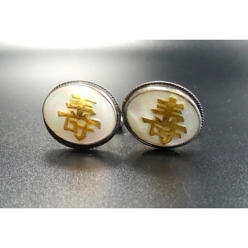 73 - PAIR OF HONG KONG STERLING SILVER CUFFLINKS
the oval tops with mother of pearl and applied character... 