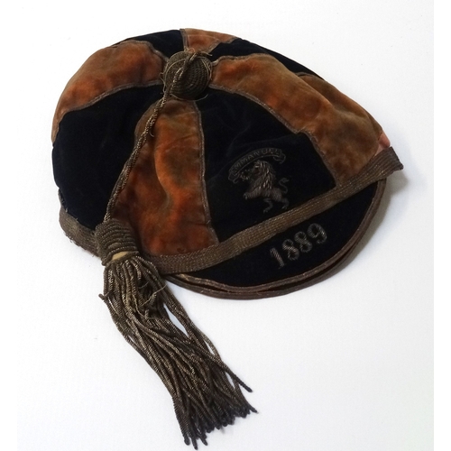 324 - VICTORIAN SPORTING CAP
with bullion embroidered lion rampant beneath 'Emmanuel' and dated 1889, bull... 