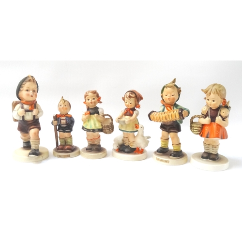 204 - FIVE PORCELAIN GOEBEL FIGURES
depicting young children and a similar German figure marked M.J.H (6)