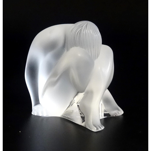 209 - LALIQUE FROSTED GLASS FIGURINE
of a nude maiden with her head resting on her crossed legs, signed to... 