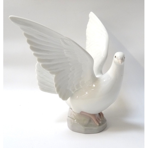 218 - LLADRO FIGUREOF A DOVE
with wings outstretched, impressed 6288 to the base, 20.5cm