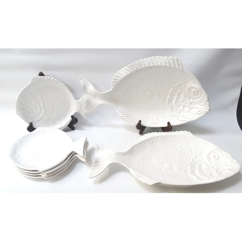 214 - FIVE PORTUGUESE POTTERY FISH PLATES
each modeled as a textured fish, 29cm long, together with two si... 