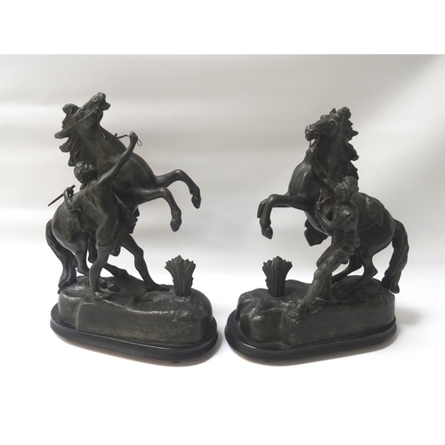 272 - PAIR OF SPELTER FIGURES
each depicting a groom with a rearing horse on a naturalistic base, raised o... 