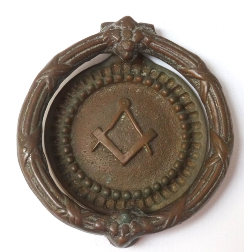 278 - MASONIC BRASS DOOR KNOCKER
with a circular banded handle, the circular knocker back plate with the s... 