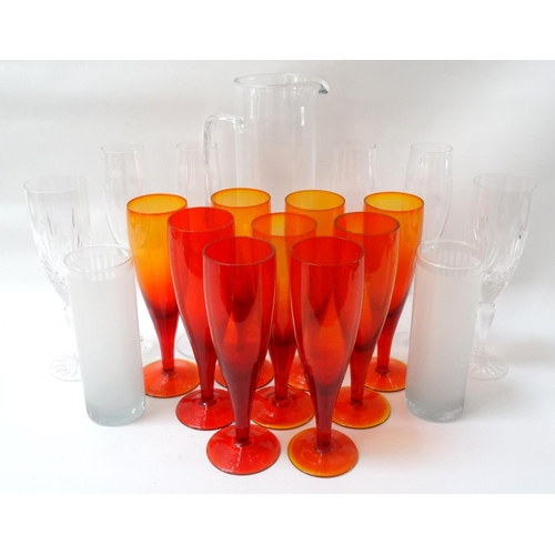 222 - SELECTION OF GLASSWARE
including nine orange glass champagne flutes, four champagne flutes with flor... 