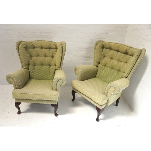 506 - PAIR OF WING BACK ARMCHAIRS
with button backs and scroll arms, covered in an apple green material wi... 