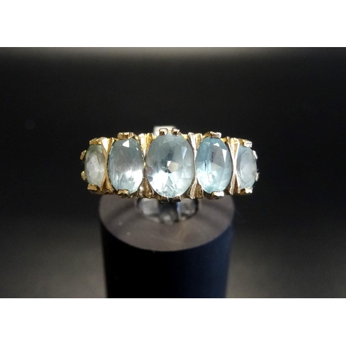 68 - AQUAMARINE FIVE STONE RING
with five graduated oval cut aquamarines, on nine carat gold shank, ring ... 