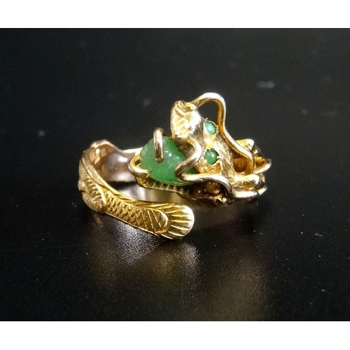 77 - CHINESE FOURTEEN CARAT GOLD DRAGON DESIGN RING
the intricate dragon's head with jade eyes and with l... 