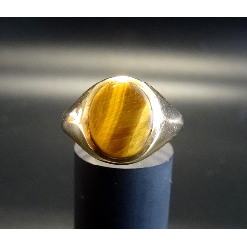 88 - TIGER'S EYE SIGNET RING
on nine carat gold shank, ring size W