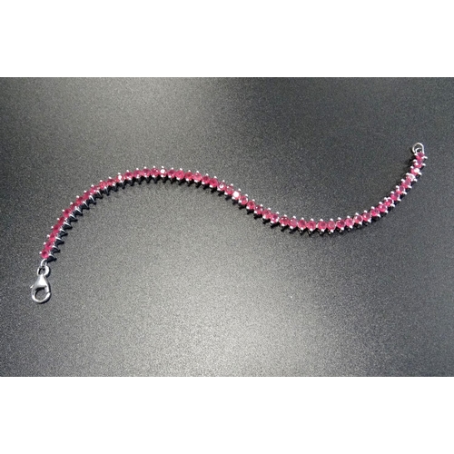 91 - RUBY LINE BRACELET
in silver, approximately 18.5cm long