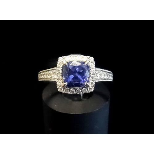 117 - TANZANITE AND DIAMOND CLUSTER RING
the cushion cut tanzanite approximately 0.9cts in diamond surroun... 