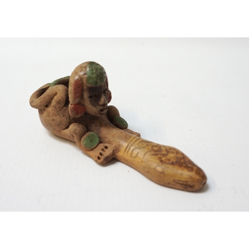 285 - SOUTH AMERICAN EARTHENWARE PHALLIC PIPE
depicting a painted man crouching with his arms wrapped arou... 