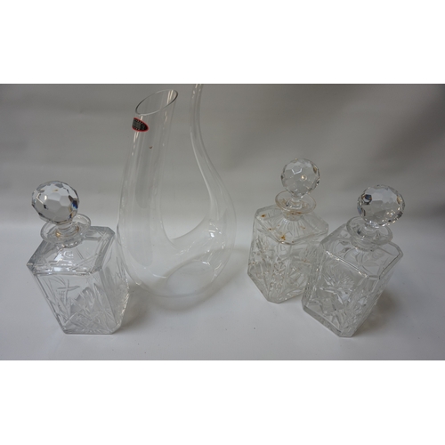 220 - RIEDEL AMADEO FATTO A MANO CRYSTAL DECANTER
of organic blown form, a pair of lead crystal square spi... 