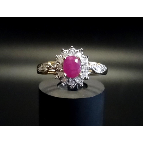 71 - RUBY AND DIAMOND CLUSTER RING
the central oval cut ruby in diamond surround and with two diamonds to... 