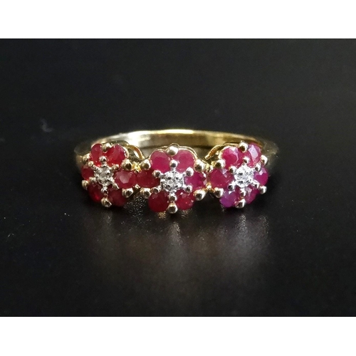 93 - RUBY AND DIAMOND TRIPLE CLUSTER RING
each of the three small diamonds in six ruby surround, on nine ... 