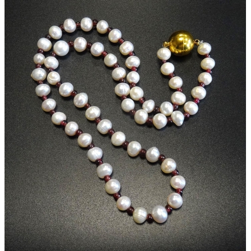 112 - CULTURED PEARL AND RUBY NECKLACE
with alternating pearls and small ruby spacers, with magnetic clasp... 