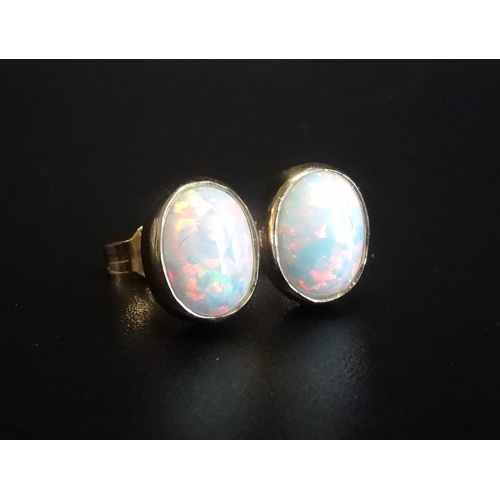 126 - PAIR OF OPAL STUD EARRINGS
in nine carat gold