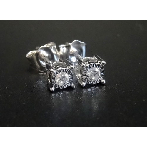 144 - PAIR OF DIAMOND STUD EARRINGS
the illusion set diamonds totalling approximately 0.1cts, in nine cara... 