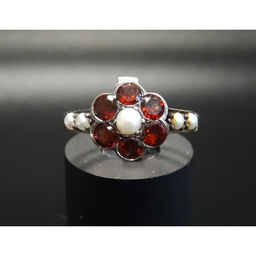 152 - GARNET AND PEARL CLUSTER RING
on unmarked gold shank with silver setting, ring size N - RETURNED