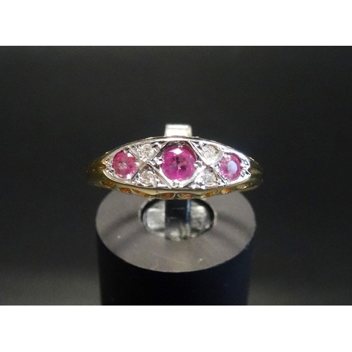 167 - RUBY AND DIAMOND RING
the three graduated rubies separated by small diamonds, on eighteen carat gold... 