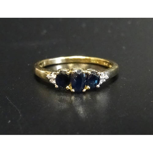 171 - SAPPHIRE AND DIAMOND RING
the three graduated oval cut sapphires flanked by small diamonds to the sh... 