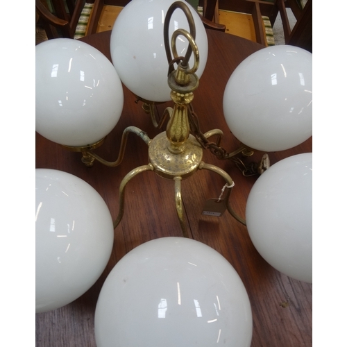 539 - LARGE GILT BRASS CEILING LIGHT
with a shaped central body with suspension chain and six scroll arms ... 