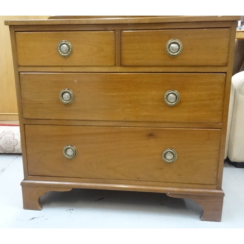 545 - MAHOGANY DRESSING CHEST
with a shaped raised back above two short and two long drawers, standing on ... 