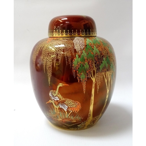 227 - CARLTON WARE ROUGE ROYALE GINGER JAR
decorated with cranes on a red lustre ground , 19cm high