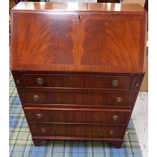 521 - MAHOGANY BUREAU
with an inset red leather fall flap and fitted interior above four graduated and coc... 