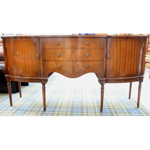 523 - GEORGIAN STYLE MAHOGANY BOW FRONT SIDEBOARD
with three central drawers flanked by a pair of cupboard... 