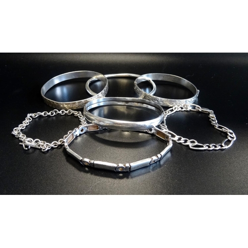 151 - FOUR SILVER BANGLES
together with three silver bracelets (7)