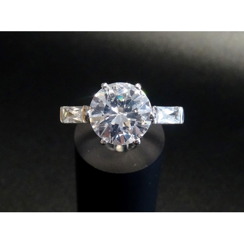 169 - LARGE CZ SOLITAIRE RING
in nine carat white gold shank, ring size N - RETURNED