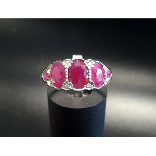 173 - RUBY AND DIAMOND DRESS RING
on fifteen carat gold shank with silver setting, ring size M - RETURNED