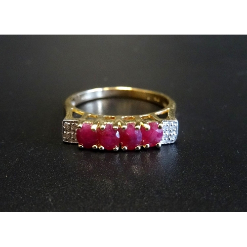 69 - RUBY AND DIAMOND RING
the four oval cut rubies flanked by four small diamonds to each shoulder, on n... 