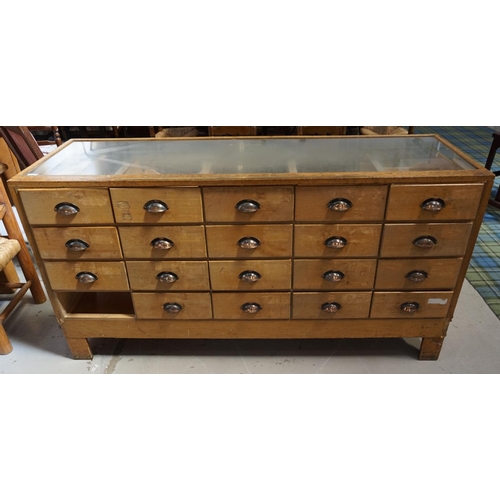 516 - 1950s MIXED WOOD AND GLAZED DISPLAY CABINET
with nineteen cup handled drawers to one side, brass mea... 