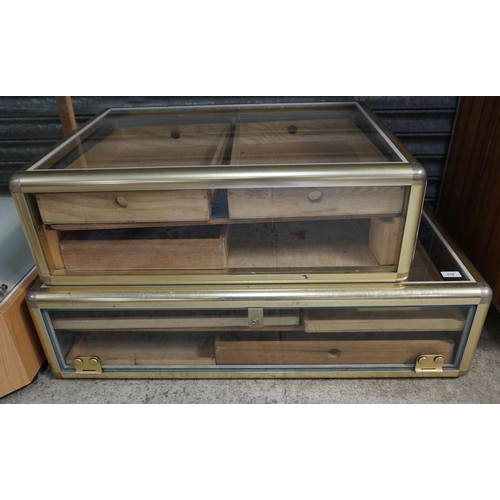 518 - TWO SHALLOW GLAZED DISPLAY CABINETS
with drawer interiors, the first 98cm long x 60cm wide, the seco... 